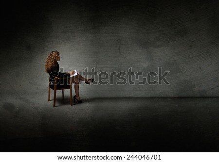 secretary with high heels posing in a dark room
