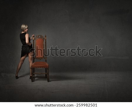 woman posing with chair
