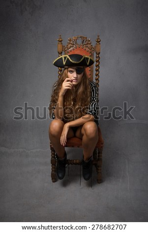 fashionable pirate sitting, abstract room