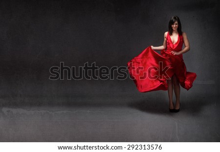 girl in red dress dancing flamenco