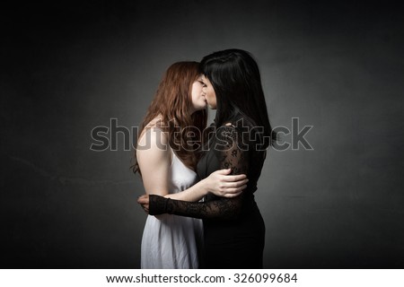sexy kiss for two woman, dark background