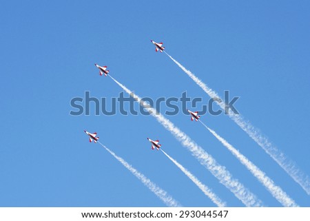 Singapore - June 27, 2015: RSAF\'s Black Knights flypast at Singapore National Day Parade, lined up as 5 stars which depicts Singapore\'s ideals of democracy, peace, progress, justice and equality.