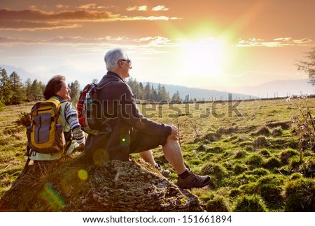 seniors hiking in nature on an autumn day