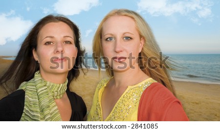 two girls taking a walk by the sea
