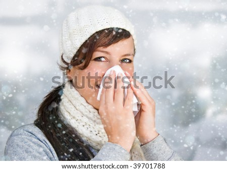 woman with a cold holding a tissue - it's snowing