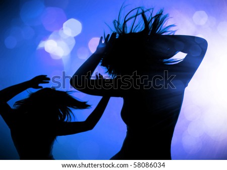 dancing silhouettes of women in a nightclub