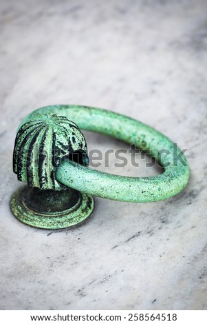old copper ring on grave of cemetery