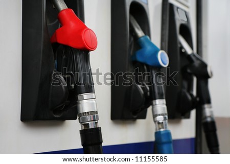 Refueling hose at modern petrol filling station