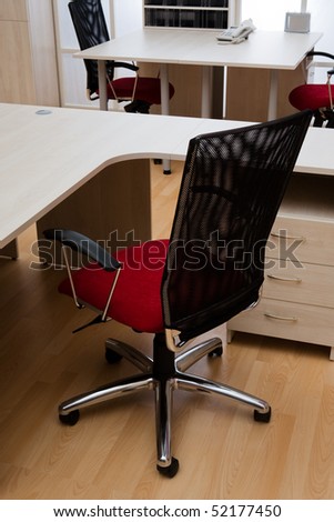 new red chair in a modern office