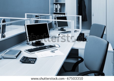 computers on a desk in a modern office