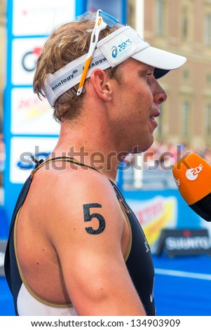 STOCKHOLM - AUG, 24: Steffen Justus from Germany is being interviewed after the Mens ITU World Triathlon Series event Aug 24, 2012 in Stockholm, Sweden