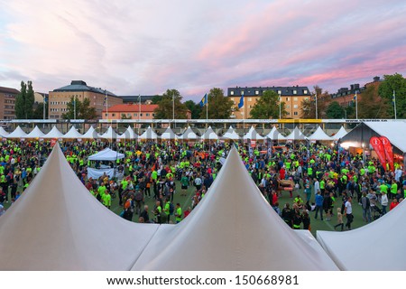 STOCKHOLM - AUG, 17: People gathering before the Midnight Run (Midnattsloppet) event at Zinkensdamm Sports Arena to check in. Aug 17, 2013 in Stockholm, Sweden