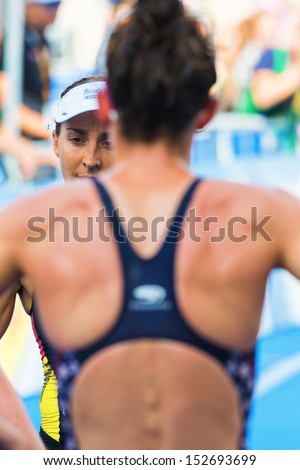 STOCKHOLM - AUG, 24: Anne Haug approching Gwen Jorgensen for an hug after the finish line in the Womens ITU World Triathlon Series event Aug 24, 2013 in Stockholm, Sweden