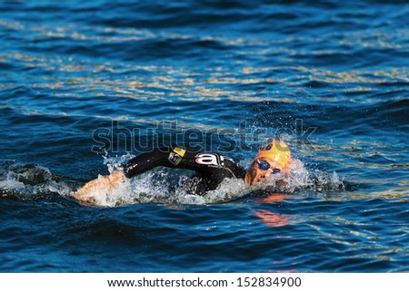 STOCKHOLM - AUG, 25: Warm up swimming by Aurelien Raphael (FRA) in the cold water before the race in the Men ITU World Triathlon Series event Aug 25, 2013 in Stockholm, Sweden