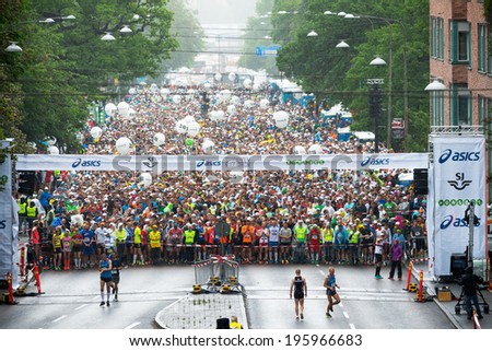 STOCKHOLM - MAY 31: A raincloud come in just before the start of ASICS Stockholm Marathon 2014. May 31, 2014 in Stockholm, Sweden. 16736 people started 2014.