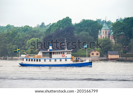 STOCKHOLM, NACKA - JUNE 29: Old Steamship with passengers trafficking the Stockholm archipelago during a foggy day. June 29, 2014 in Stockholm, Sweden.
