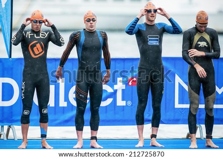 STOCKHOLM - AUG, 23: Triathletes getting ready for start in the mens swimming in the cold water at the Mens ITU World Triathlon Series event Aug 23, 2014 in Stockholm, Sweden