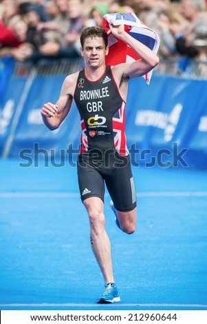 STOCKHOLM - AUG, 23: Winner Jonathan Brownlee crossing the finish line and win the Mens ITU World Triathlon Series event August 23, 2014 in Stockholm, Sweden. Jonathan Brownlee won the race.