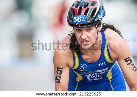 STOCKHOLM - AUG, 23: Asa Annerstedt from Sweden in closeup after the transition to cycling at the Womans ITU World Triathlon Series event August 23, 2014 in Stockholm, Sweden