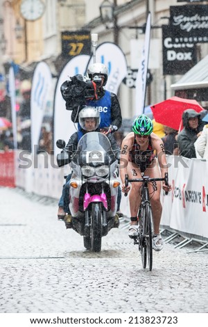 STOCKHOLM - AUG, 23: Katie Hursley from USA cycling in the heavy rain at the Womans ITU World Triathlon Series event August 23, 2014 in Stockholm, Sweden
