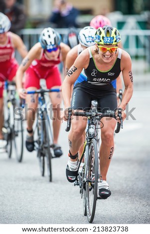 STOCKHOLM - AUG, 23: Mateja Simic from Slovakia first in a group cycling in the rain at the Womans ITU World Triathlon Series event August 23, 2014 in Stockholm, Sweden