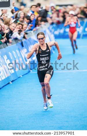 STOCKHOLM - AUG, 23: Nicky Samuels from New Zeeland running to the finish line in the Womens ITU World Triathlon Series event Aug. 23, 2014 in Stockholm, Sweden