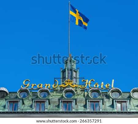 STOCKHOLM, SWEDEN - MAR 31: Grand Hotel sign with the swedish flag, March 31, 2015 in Stockholm, Sweden. Since 1901, the Nobel Prize laureates and their families have been guests at the hotel