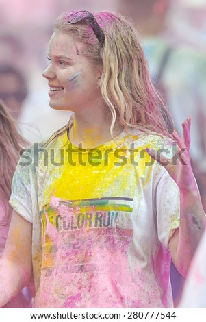 STOCKHOLM, SWEDEN - MAY 23: Happy girl at Stockholm Color Run in Tantolunden or Tanto on May 23, 2015. People from all walks of life participated in the run.