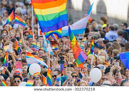 STOCKHOLM, SWEDEN - AUGUST 1, 2015: Big crowd walking with the Pride parade in Stockholm. Approx 400.000 gathered at the streets.