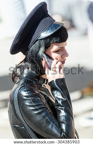 STOCKHOLM, SWEDEN - AUGUST 1, 2015: Woman in black rubber clothes in goth style at the Pride parade in Stockholm. Approx 400.000 spectators at the streets.