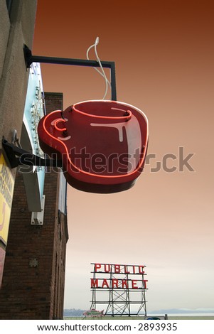 Coffee cup neon sign and Pike Street Market in Seattle