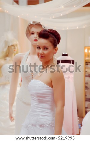 Pretty, young woman in a white wedding gown.