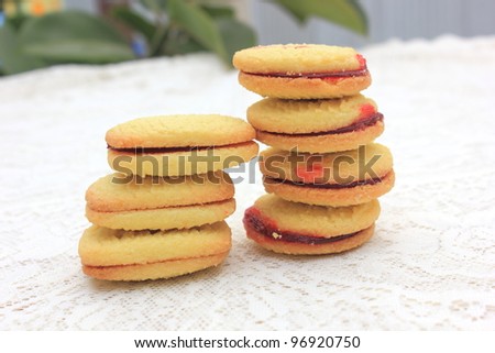 Jam shortbread biscuits on a lace table cloth