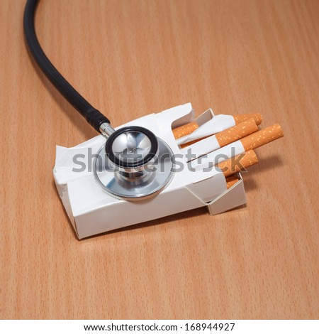 Stethoscope and cigarettes box  not good health care
