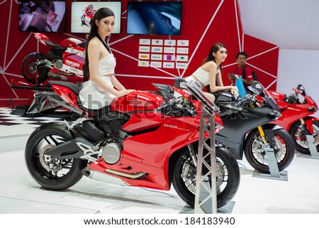 BANGKOK - MARCH 26 : Unidentified pretty women presenter of new Models Ducati Monster motorcycle on display at The 35th Bangkok International Motor Show 2014 on March 26, 2014 in Bangkok, Thailand.