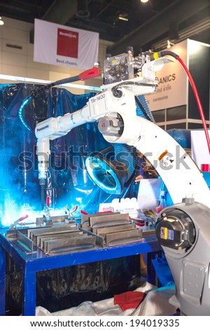 BANGKOK ,THAILAND - MAY 17: Industrial welder robotic arm in ASEAN's Leading  Industrial Machinery and Subcontracting Exhibition 2014,on May 17, 2014 in  Bangkok, Thailand.