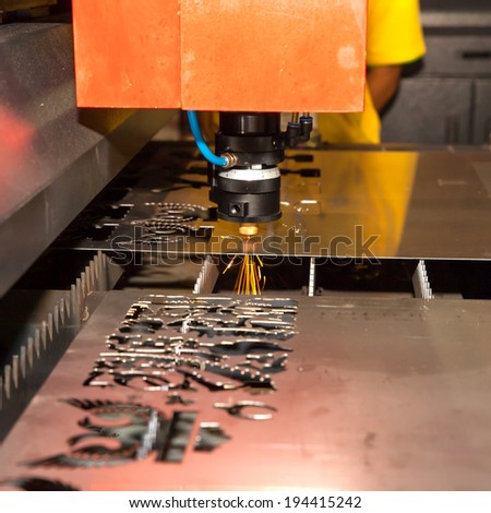 BANGKOK ,THAILAND - MAY 18:Laser cutting on Metal  ASEAN\'s Leading Industrial Machinery and Subcontracting Exhibition 2014,on May 18, 2014 in Bangkok, Thailand.