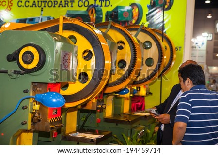 BANGKOK ,THAILAND - MAY 18:Metal stamping machine ASEAN\'s Leading Industrial Machinery and Subcontracting  Exhibition 2014,on May 18, 2014 in Bangkok, Thailand.