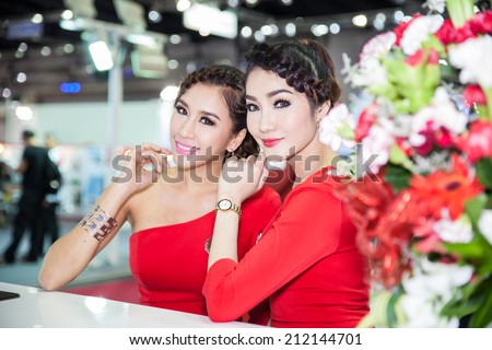 BANGKOK - AUGUST 16 :An unidentified female presenter models at MG booth at Big Motor Sale 2014 on June 16,2014 in BITEC ,Bangkok, Thailand.