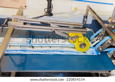 BANGKOK - SEPTEMBER 27 :machines gummed on paper box display at GASMA PRINT 2014 on Sep 27,2014 in BITEC ,Bangkok, Thailand.