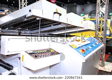 BANGKOK - SEPTEMBER 27 :Plastic coating on paper  machines display at GASMA PRINT 2014 on Sep  27,2014 in BITEC ,Bangkok, Thailand.