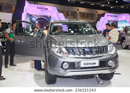 NONTHABURI - DECEMBER 4 :unidentified people  interest with All new Triton  on display at  MOTOR EXPO 2014 on Dec 4,2014 in Nonthaburi,  Thailand.