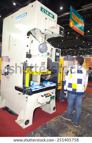 BANGKOK ,THAILAND - FEBRUARY 7: Unidentified people interesting with book  packer machine At THAILAND Industrial Fair 2015 And Food Pack Asia 2015 on  February 7, 2015 in Bangkok, Thailand.