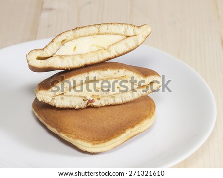 Dorayaki, Japanese Sweet  Pancakes on Wooden Table