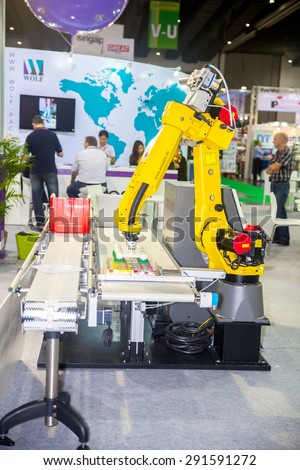 BANGKOK ,THAILAND - JUNE 20: Show robotic hand machine on work in \
PROPAK ASIA 2015, on JUNE 20, 2015 in Bangkok, Thailand.