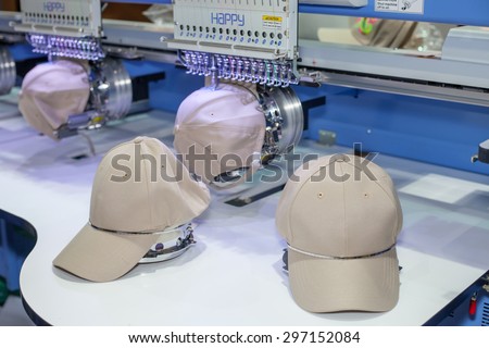 BANGKOK ,THAILAND - JULY 11: Cap on embroidery machine at Garment \
Manufacturers Sourcing Expo 2015 (GFT 2015) , on JULY 11, 2015 in \
Bangkok, Thailand.