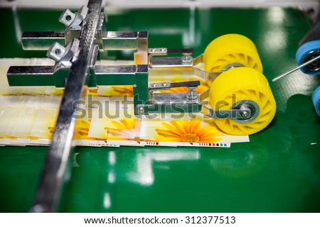 BANGKOK - AUGUST 29 : machines gummed on post card paper at \
Pack Print and T-PLAS THAILAND on Aug 29,2015 in BITEC \
,Bangkok, Thailand.