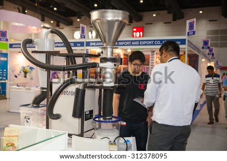 BANGKOK - AUGUST 29 :Unidentified people interesting with sort out polymer resins tool at Pack Print and T-PLAS THAILAND on Aug 29,2015 in BITEC ,Bangkok, Thailand.