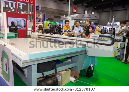 BANGKOK - AUGUST 29 :Unidentified people interesting with  UV printing and coating on paper  at Pack Print and T-PLAS THAILAND on Aug 29,2015 in BITEC ,Bangkok, Thailand.