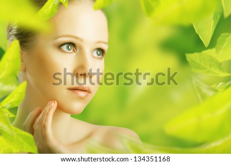 beauty woman and a natural skin care in herbal green background